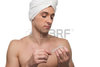 22550040-man-with-a-towel-on-a-head-is-doing-manicure.jpg