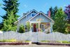 12621458-Cute-small-grey-old-craftsman-style-house-with-white-fence--Stock-Photo.jpg